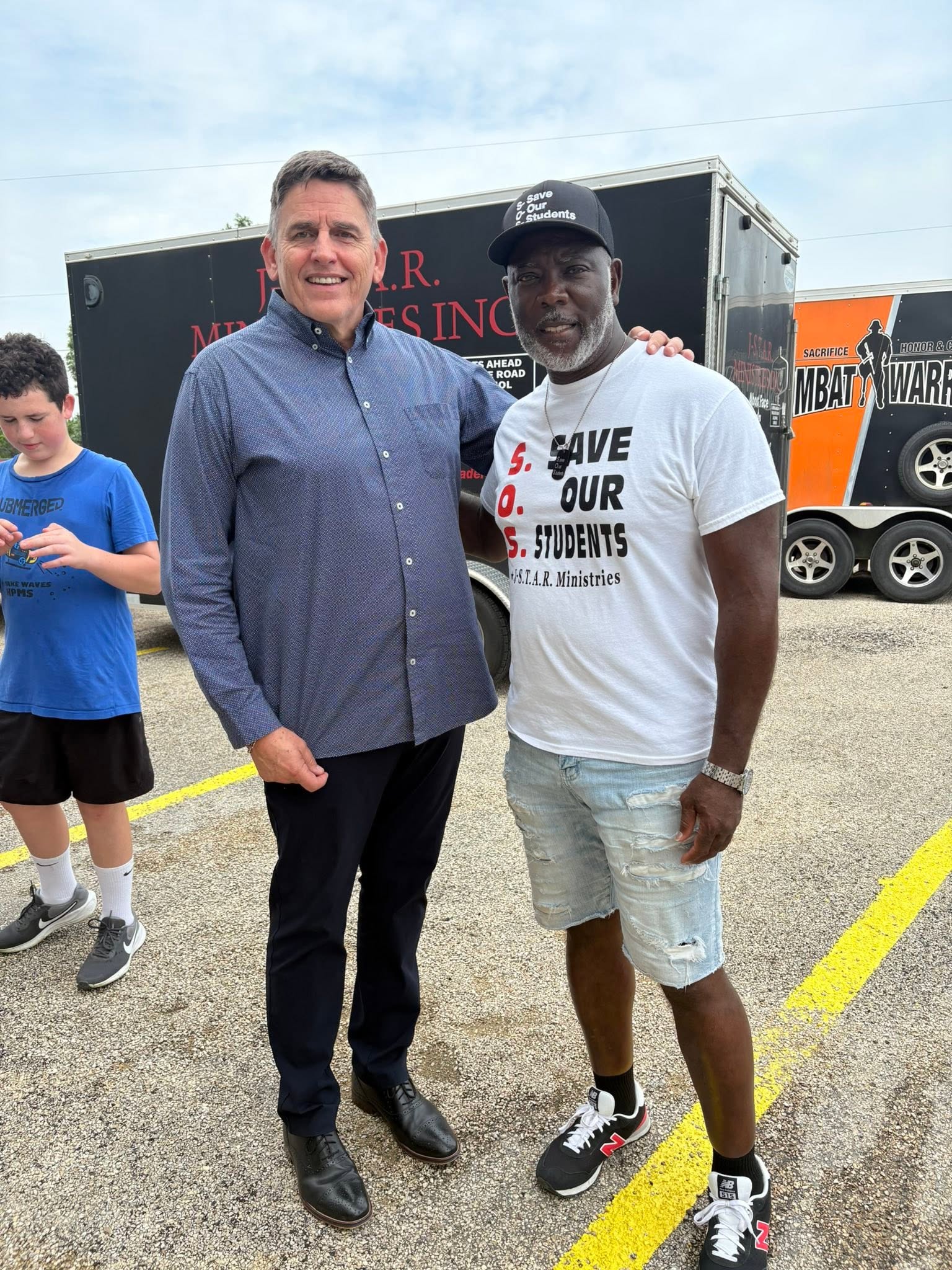 Patrick beside the J-STAR and Combat Warriors relief trailers during the Kerrville delivery.