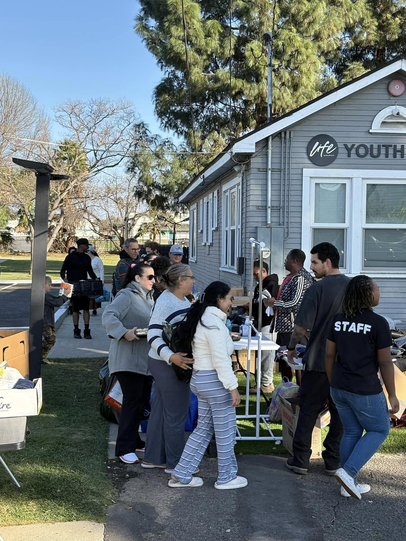 Families and staff at the California wildfire-relief distribution during Trip #60.