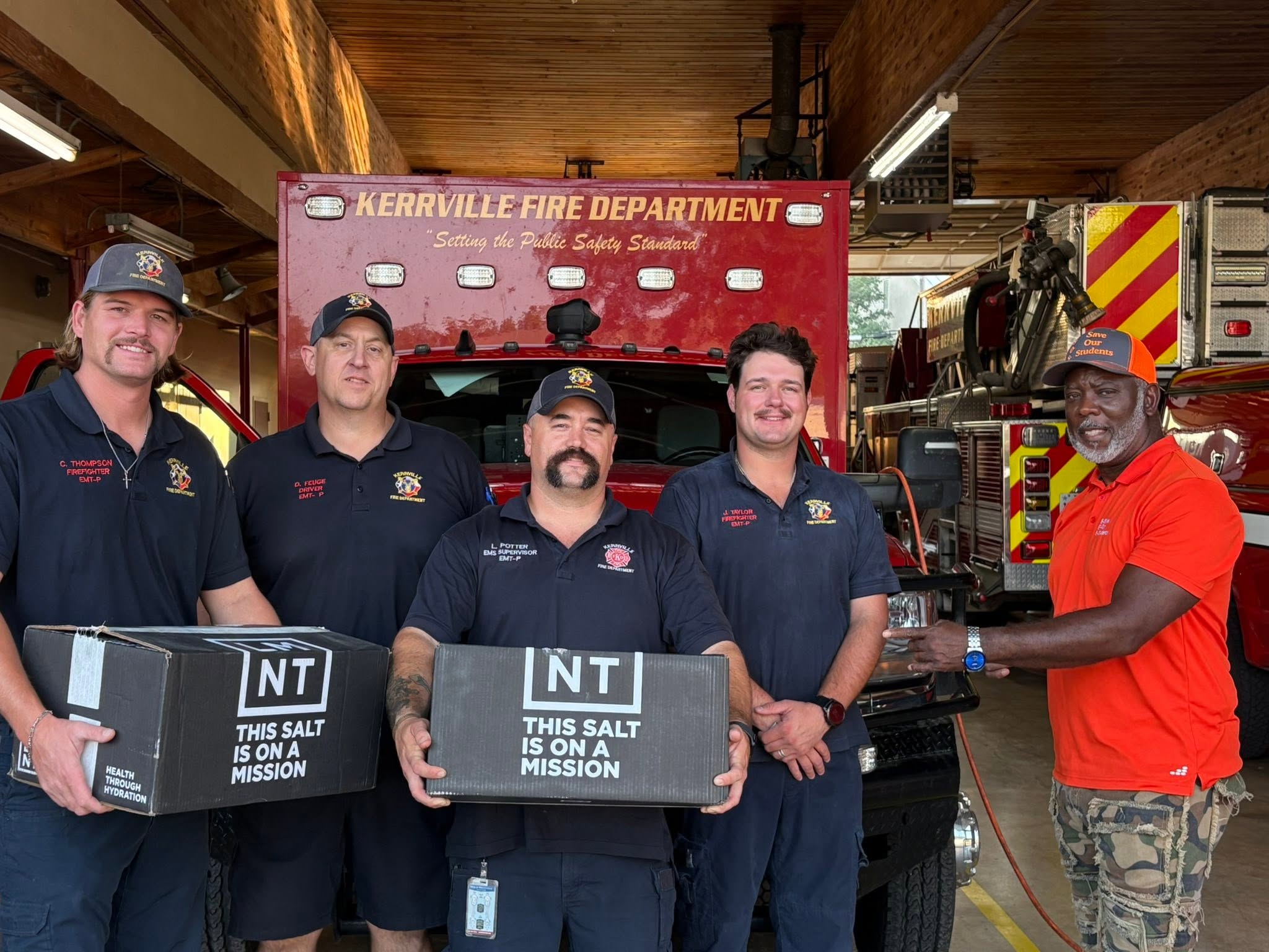Patrick with Kerrville firefighters and donated hydration supplies during Trip #73.