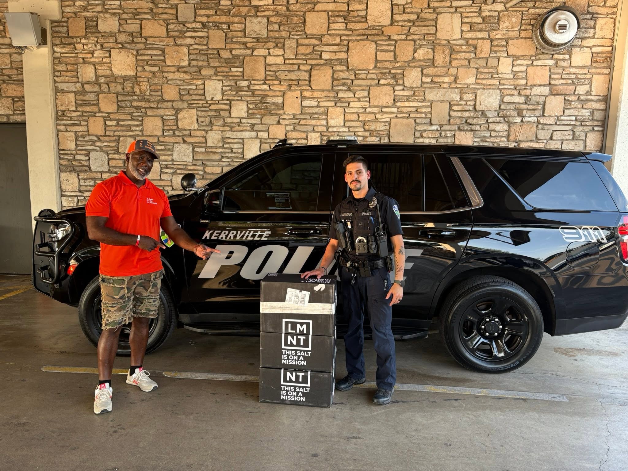 Patrick delivers hydration supplies to a Kerrville police officer during Trip #73.