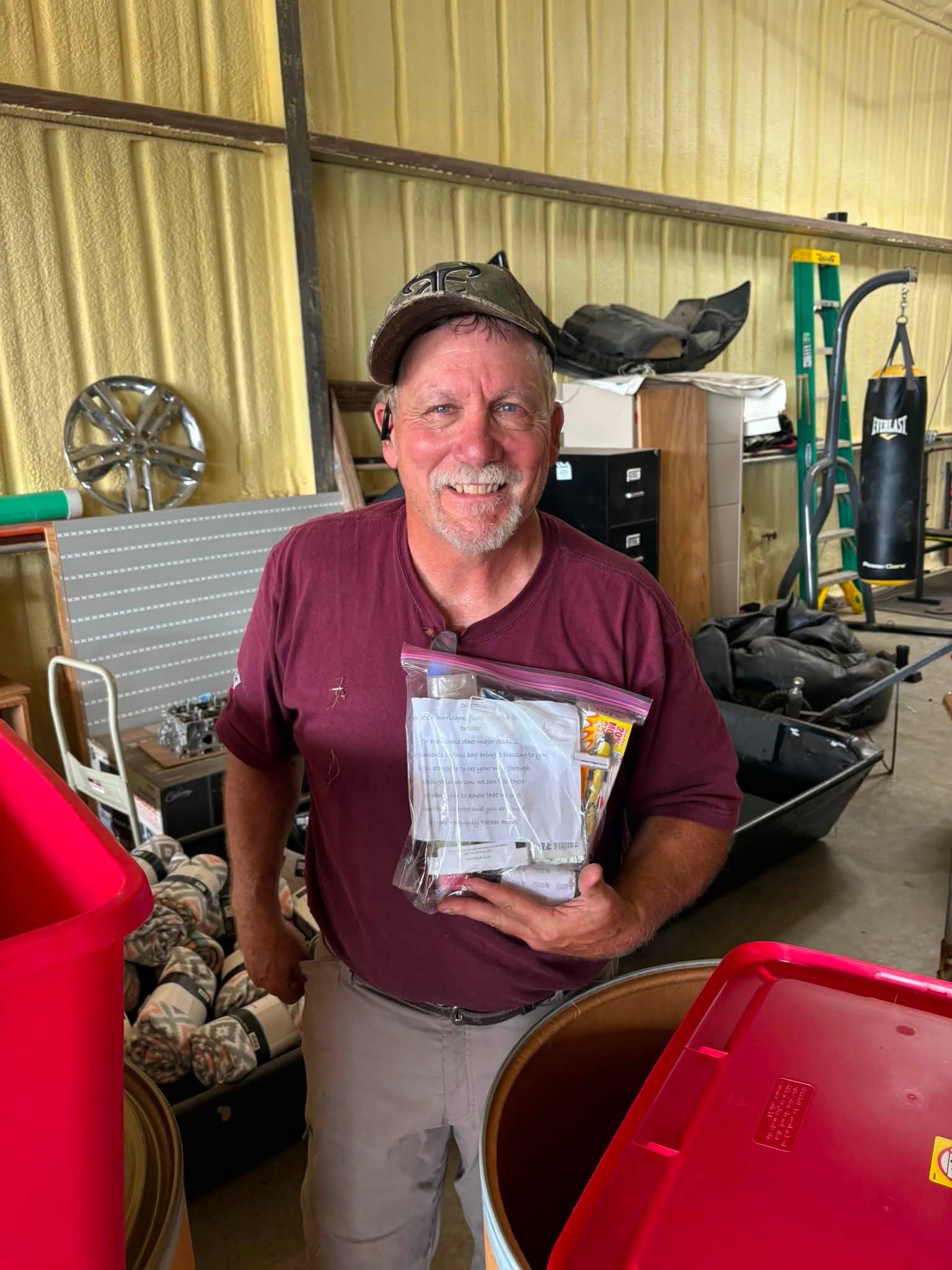A Runaway Bay neighbor receives a relief kit during Patrick’s tornado response.